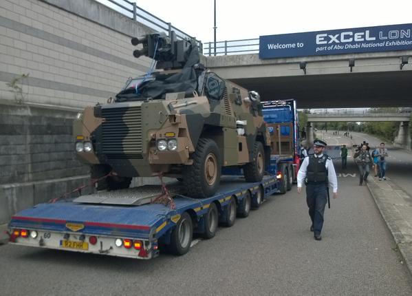 An armoured vehicle on top of a HGV truck